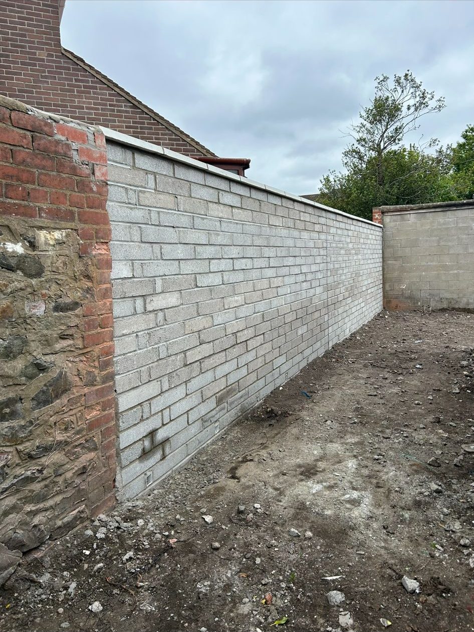 Newly built buff brick wall by RD Construction